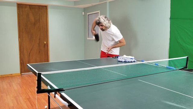 Man playing table tennis player servings underspin backspin sidespin topspin