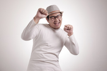 Fototapeta premium Happy Funny Asian Man Dancing Full of Joy, Winning