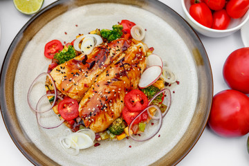 Fish fillet with sesame rice, and vegetables, healthy food on a decorated table