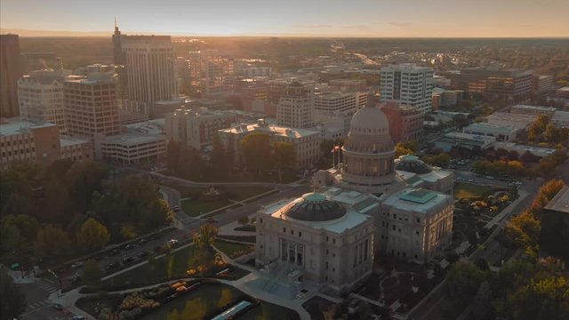 Aerial flying over Idaho State Capitol Building and downtown Boise at sunset. Boise, Idaho, USA. 5 October 2019