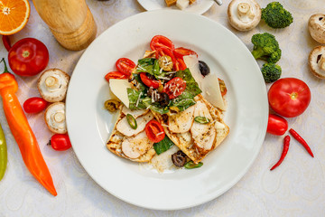 panini with chicken and vegetables on a plate on a decorated table