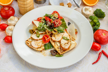 panini with chicken and vegetables on a plate on a decorated table