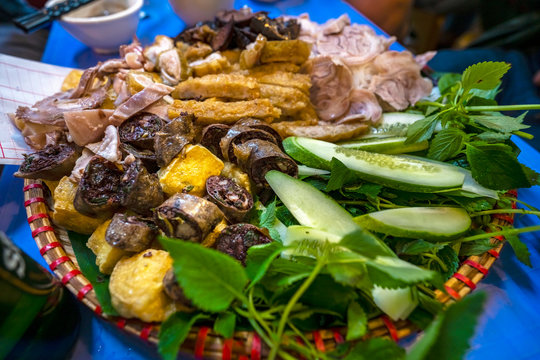 In Hanoi, Vietnamese food, Banh Gio or pyramid shaped rice dough dumpling filled with pork, shallot, and wood ear mushroom wrapped in banana leaf, is delicious street food, dish make from rice flour
