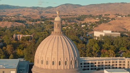 Aerial flying over Idaho State Capitol Building and downtown Boise at sunset. Boise, Idaho, USA. 5 October 2019