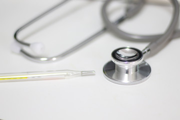 Stethoscope isolated equipment on white texture with blurred background