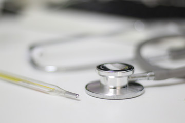 Stethoscope isolated equipment on white texture with blurred background