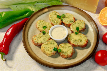 garlic bread with cheese and herbs on a white decorated table