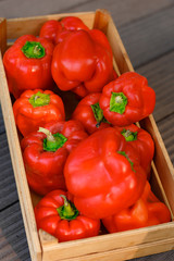 red bell pepper in a wooden box, healthy food