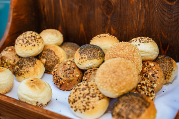 fresh bread with sesame and poppy seeds in a wooden box