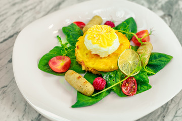Vegetable pancake with chicken nipples and boiled egg. Breakfast