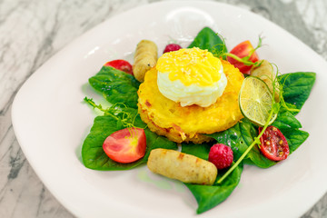 Vegetable pancake with chicken nipples and boiled egg. Breakfast
