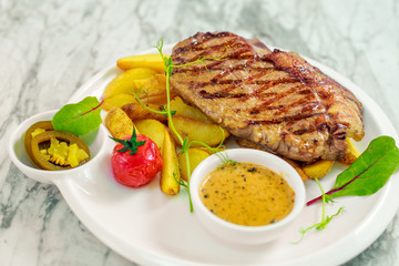 beef steak with vegetables, jalapeno sauce and pepper