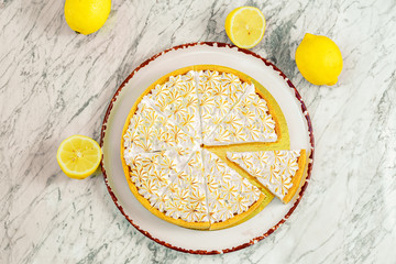 cream lemon cake on a marble table