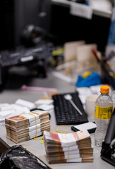 Bundles of banknotes with currency bands on the counting table