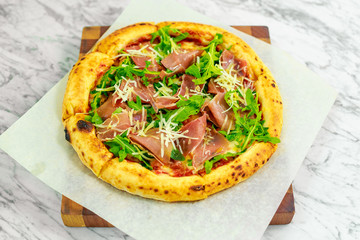 Italian pizza with mozzarella and basil