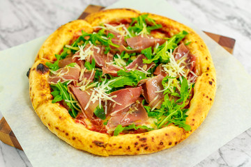 Italian pizza with mozzarella and basil