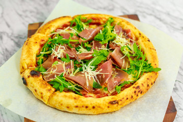 Italian pizza with mozzarella and basil