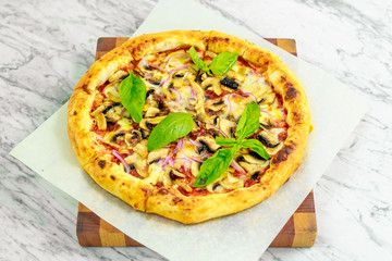 Italian pizza with mozzarella and basil