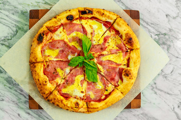 Italian pizza with mozzarella and basil