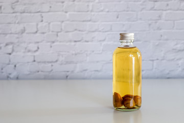 a bottle of homemade Japanese plum wine 'Umeshu'