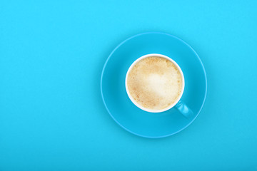 Directly Above View Of Coffee Cup On Blue Table