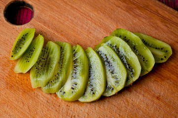 Kiwi sliced. Background for cooking. Fruit. Healthy nutrition, vitamins and vegetarianism.