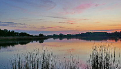 Obraz na płótnie Canvas Scenic View Of Lake During Sunset