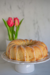 Home made sweet Raspberry Lemon Cake with tulips