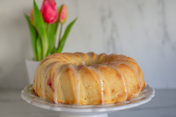 Home made sweet Raspberry Lemon Cake with tulips