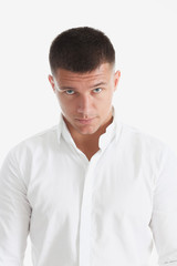 Young successful businessman on a white background in a shirt