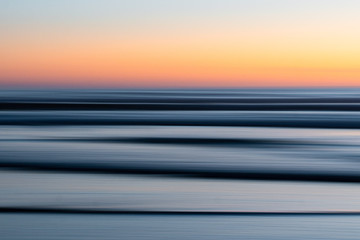 View of ocean waves during sunset