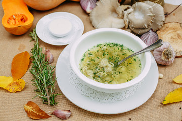 Autumn table setting with pumpkins. Thanksgiving dinner. homemade dumplings with herbs and sauce
