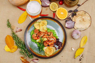 Autumn table setting with pumpkins. Thanksgiving dinner. beer shrimp with homemade potato chips