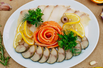 Autumn table setting with pumpkins. Thanksgiving dinner. fish platter with lemon in a white plate