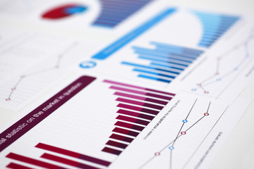 Financial statistics documents on clipboard pad at office table closeup. Internal Revenue Service inspector sum check, irs investigation, exchange market, earnings, savings, loan and credit concept