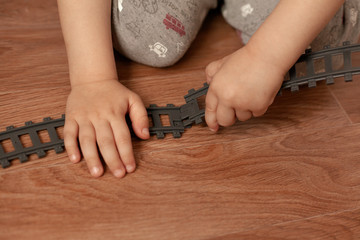 a child plays with the railway