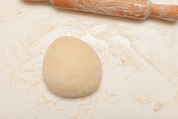 Preparation of the dough for pizza. Hands prepare the dough