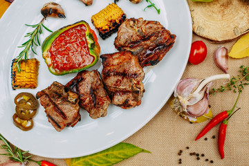 Autumn table setting with pumpkins. Thanksgiving dinner.grilled meat with vegetables
