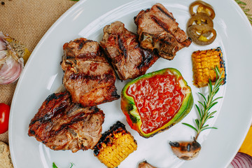 Autumn table setting with pumpkins. Thanksgiving dinner.grilled meat with vegetables