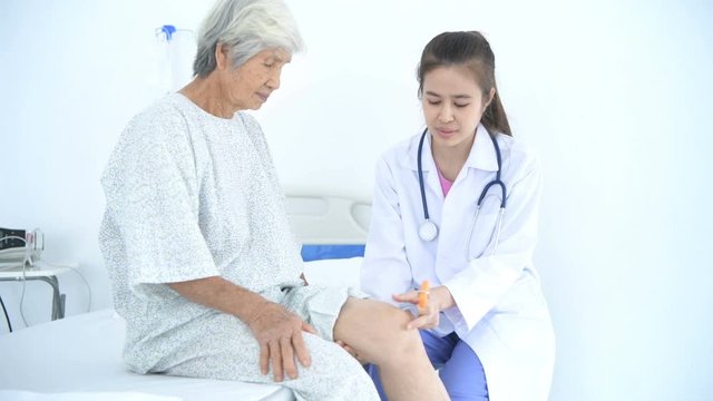 Medical concepts. The doctor is checking the patient's knee osteoarthritis in the hospital. 4k Resolution.