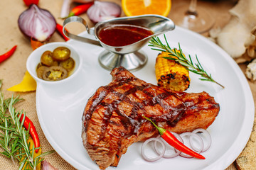 Autumn table setting with pumpkins. Thanksgiving dinner. Steak with Vegetables