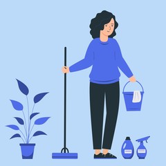 A young female does the cleaning of the house. Woman holds a mop and a bucket.