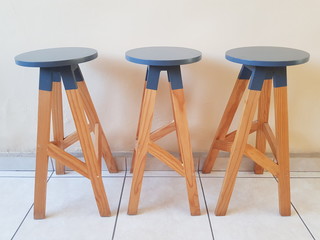 three wooden bar chair lined up inside the house