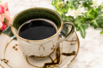 写真素材: 陶器に注がれたホットコーヒー
