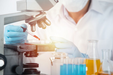 Scientist working with microscope in lab. Laboratory research concept..About experimental science...