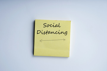 Social Distancing write on a note