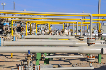 The oil production manifold at the wellsite - obrazy, fototapety, plakaty