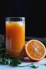 glass of orange juice with ice