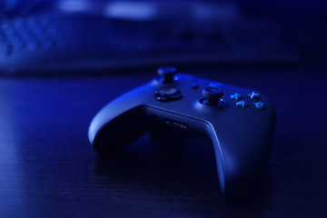 gamepad, game controller on the table, console gaming © nexusby