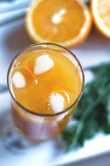 glass of orange juice with ice